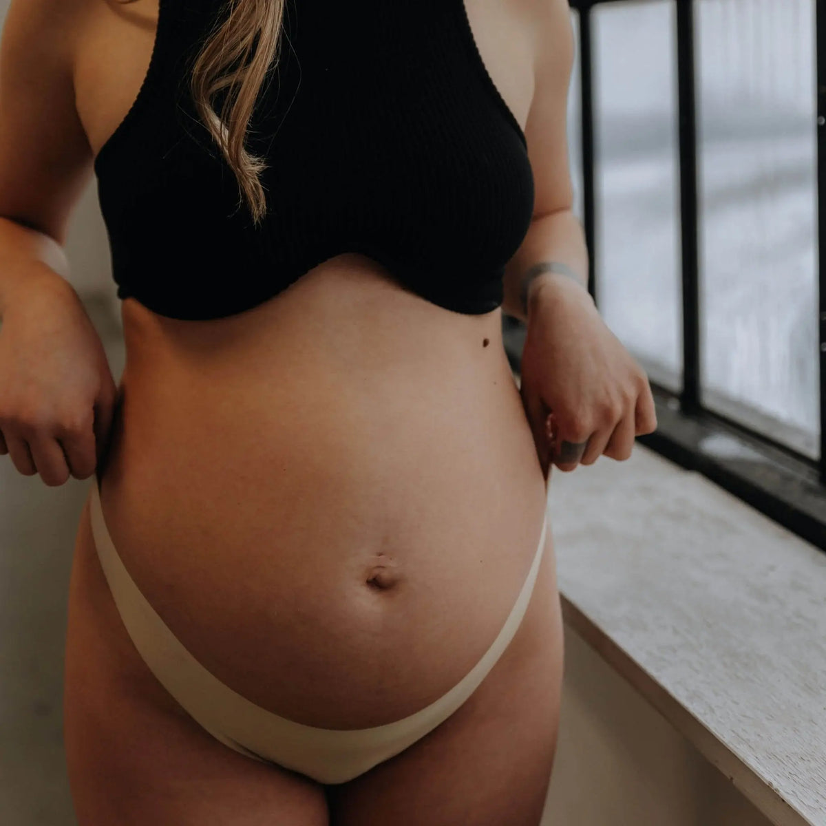 Kim porte la taille M